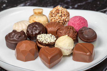Praline Chocolate. Assorted truffles or praline chocolate on dark background