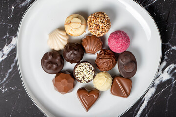 Praline Chocolate. Assorted truffles or praline chocolate on dark background