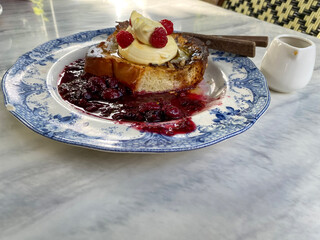 Brioche French toast with raspberries jam.