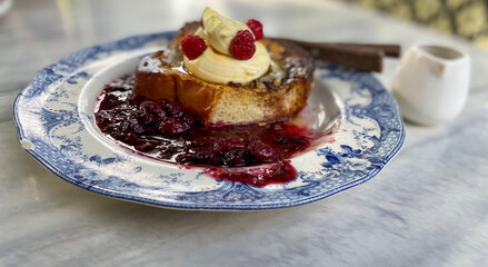 Brioche French toast with raspberries jam.