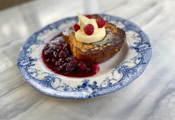Brioche French toast with raspberries jam.