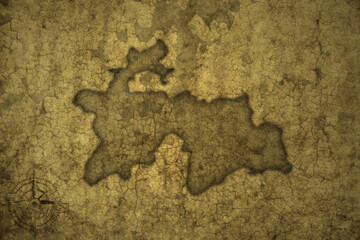 map of tajikistan on a old vintage crack paper background .