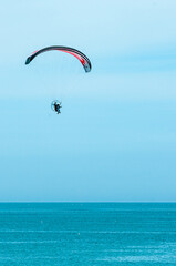 Paragliding off Giulianova beach, italy, on sunny, April day