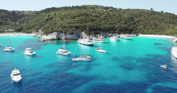 Aerial view of yacht boats achored at most beautiful beaches of Greece - Vrika in Antipaxos. Ionian islands