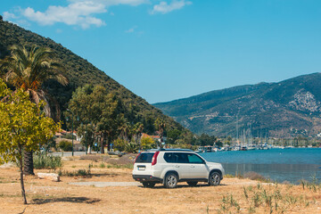 suv car at the beach of sea bay Lefkada island