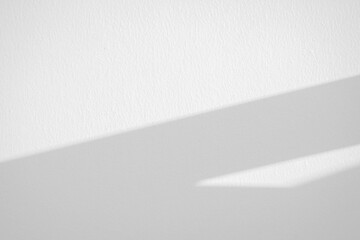 White cement wall texture background with shadow sunlight.