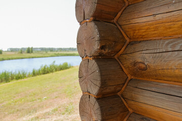 log house close-up in the village on the background of the lake
