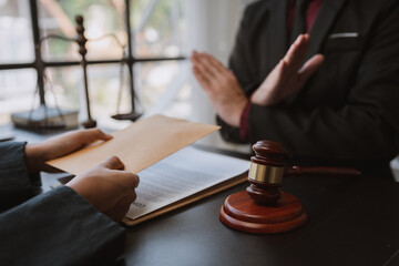 Lawyer or legal adviser, businessman refusing money coming with paper envelope Anti-bribery...