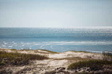 seashore with sandy beach on a sunny day
