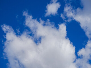 Blue sky with white fluffy clouds