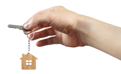 Hand holding a house key cut out