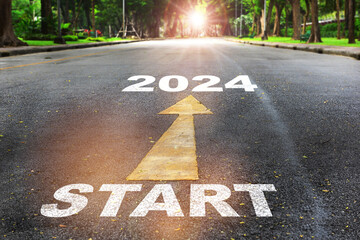 Start to 2024  written on the road on nature background with sunlight. Business planning concept...