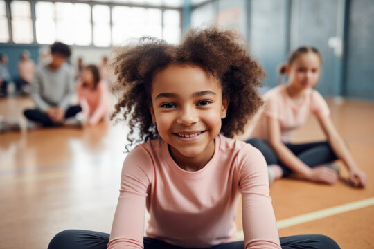 Generative AI illustration of smiling African American schoolgirl in activewear with Afro hair sitting on floor in gym during training looking at camera