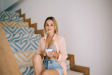 Smiling woman with cup of coffee