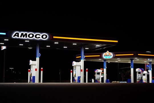 Amoco fuel station glows during the night servicing the community.