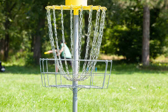 Disc golf player throwing a flying disc
