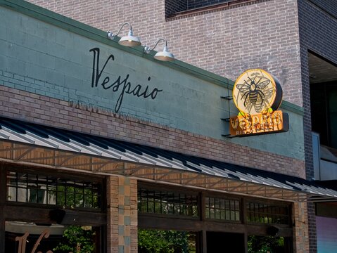 Street signs for the iconic Vespaio Italian restaurant on South Congress Avenue in Austin, Texas