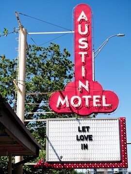 Vertical: Red neon sign of the iconic Austin Motel on South Congress Avenue in Austin, Texas since 1938