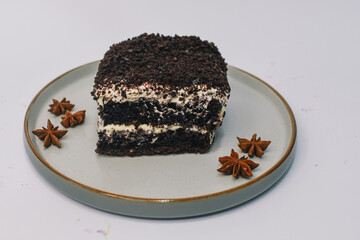 Cake with chocolate biscuit and vanilla cream