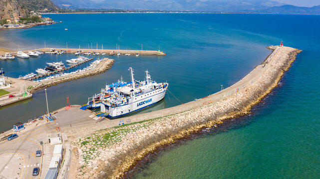 Aerial view of the Laziomar ferry anchored in the port of Terracina. The ship connects the Italian coast to the Pontine islands of Ponza and Ventotene. Terracina, Italy - May, 2023