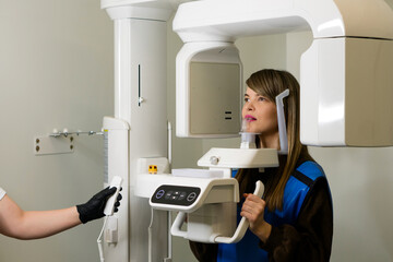 X-ray technician makes CT scan of jaw