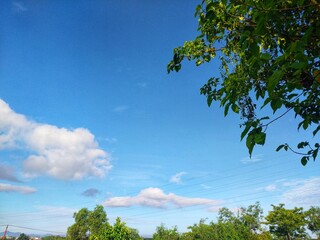 Cloudy blue sky with trees, Sidenreng Rappang Regency, South Sulawesi, Indonesia