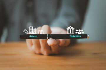 balance sheet with assets and liabilities on pen