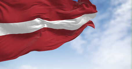 Close-up view of the Latvia national flag waving in the wind.