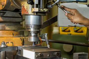 The drilling process on NC milling machine by skill operator.