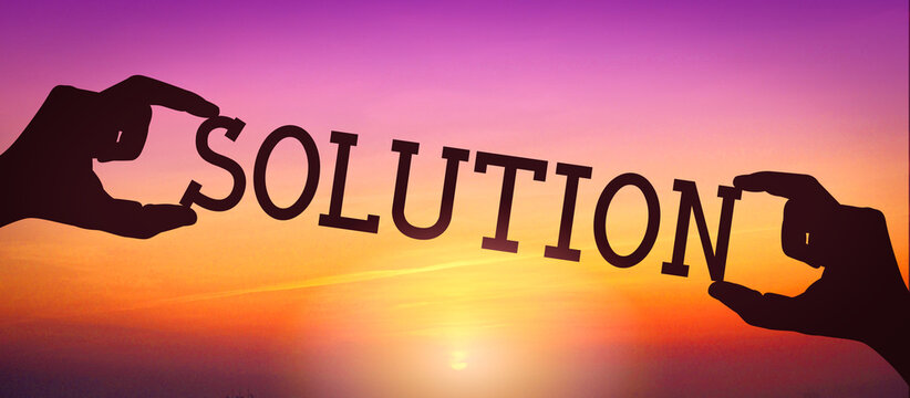 Solution - human hands holding black silhouette word