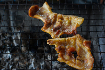 Grilled pork skins cooked well on the grill