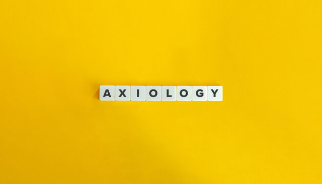 Axiology - philosophical study of value. Word on Letter Tiles on Yellow Background. Minimal Aesthetics.