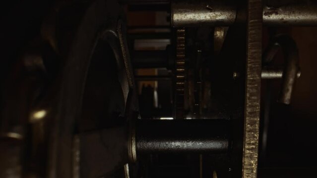 The mechanism inside the tower clock with a pendulum.