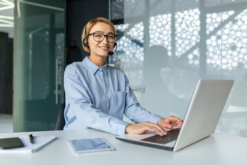 Portrait of successful online customer support office worker, satisfied business woman at workplace...