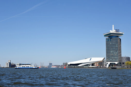 Amsterdam, Netherlands. April 2023. The river IJ with the Eye museum and a canalboat.