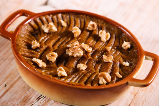 Rangeena arab halwa sweet with walnut served in dish isolated on table top view of arabic dessert