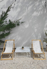 White Garden chair on stone ground in the garden park and outdoor -  exterior design vintage style - relax and chilling vibe - image from Bangkok thailand