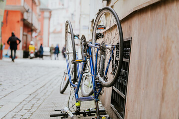 Broken bicycle abandoned in the center of the old town