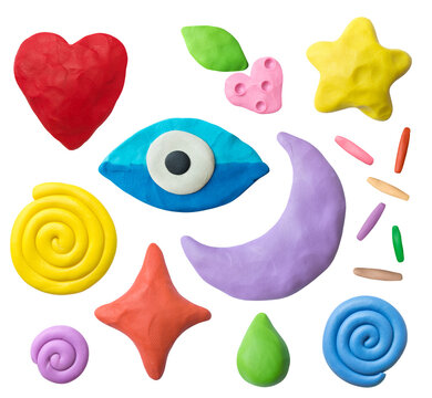 Set of plasticine objects. Handmade hearts, eyes, moons, stars, drops, berries, snails. Modelling clay.