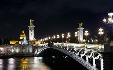 Fototapeta na wymiar Night view with Seine river and bridge in Paris, France, Europe