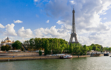 Fototapeta na wymiar City view with Eiffel tower in Paris, France, Europe in summer