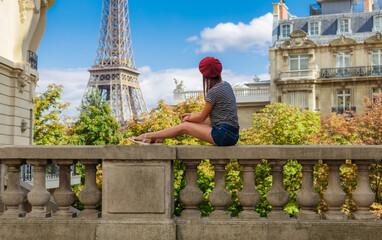 Tourist woman near Eiffel tower in Paris, France, Europe in summer