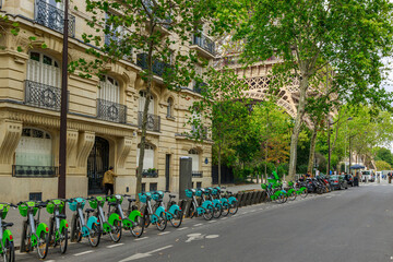 City view with Eiffel tower and bicycles in Paris, France, Europe