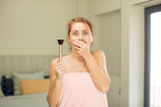 young pretty woman covering mouth with a hand and shocked or surprised expression. making up concept