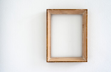 Old small blank wooden picture frame on white background 