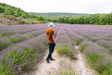 Man in the middle of a lavender field.