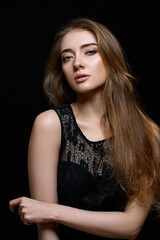 Naklejka premium gorgeous brunette woman with long hair in black dress