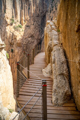 Obraz premium Views of the Caminito del Rey in Malaga, gorges, valleys, walkways, metal walkways, walking along a ferrata route during a sunny summer day