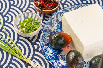 Preserved egg tofu on blue background