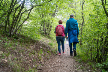 Senior couple on a walk in an spring nature.